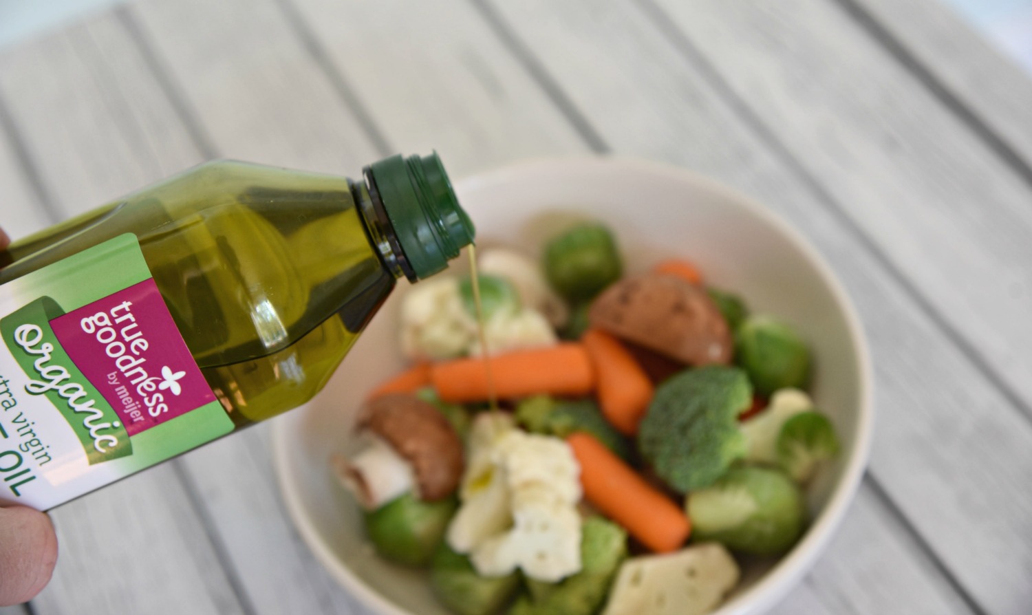Air Fryer Recipes includes tossing vegetables with olive oil. 