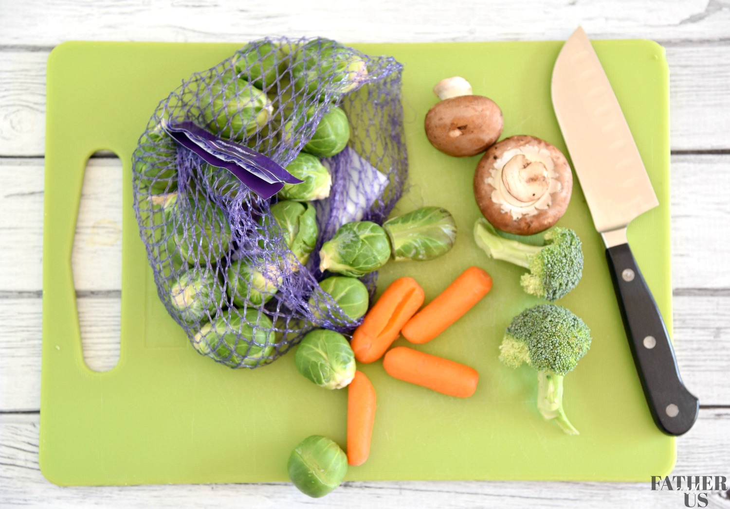 This Air Fryer Vegetable Recipe includes chopping up the vegetables on a cutting board.