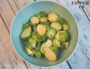 Toss your Air Fried Brussels Sprouts in olive oil, salt and garlic powder before cooking.