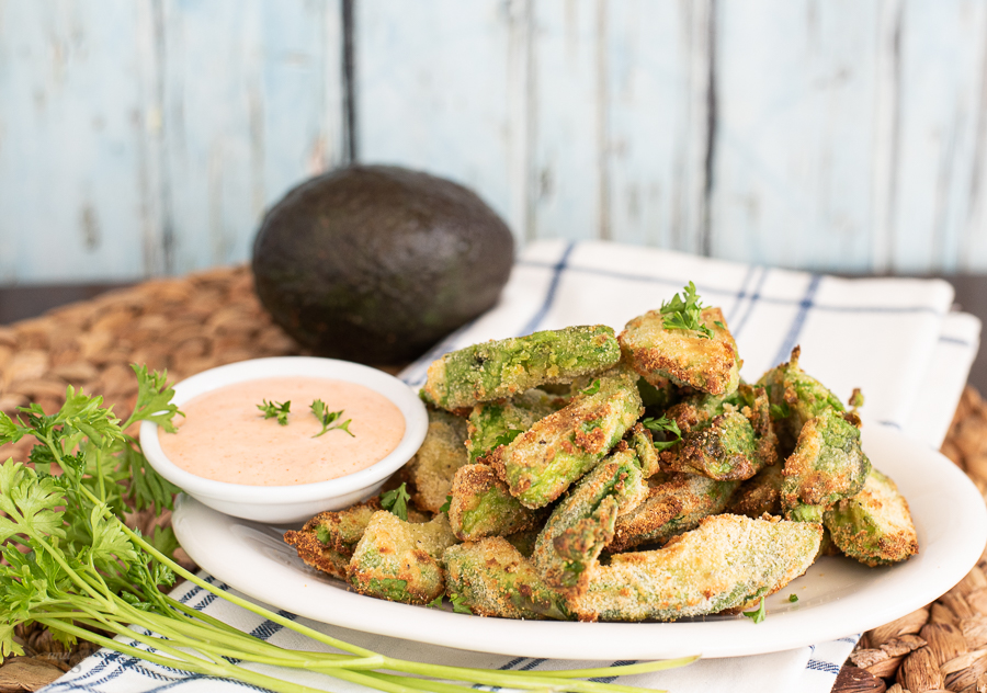 Air Fried Avocado Fries with sriracha ranch dipping sauce served on a platter.