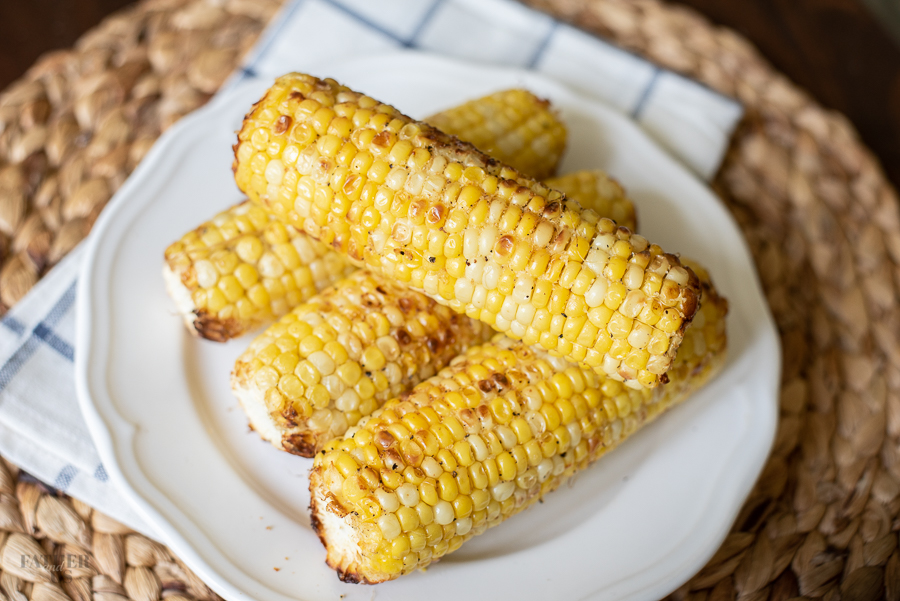 Air Fryer Corn on the cob being served on a plate for dinner.