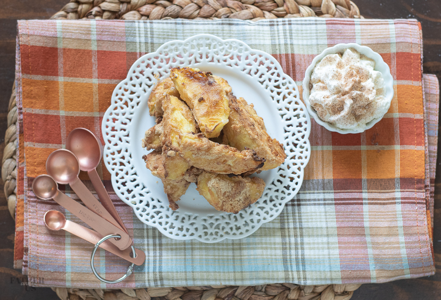 Air Fryer Apple Fries being served with a side of whipped cream for dessert. 