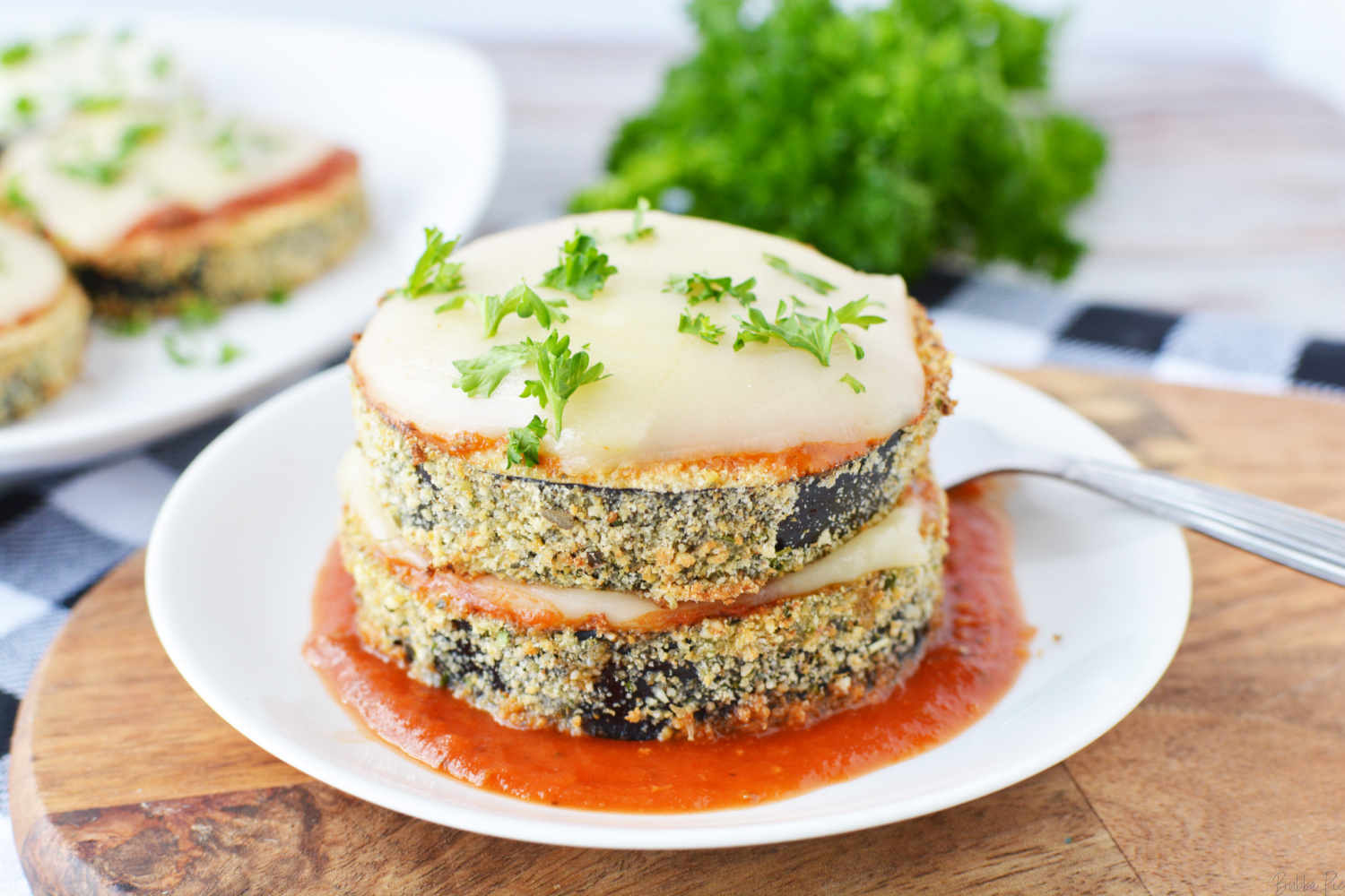 Healthy Air Fryer Eggplant Parmesan with mozzarella cheese and marinara sauce.